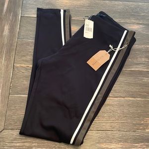 Black leggings with green & white stripes